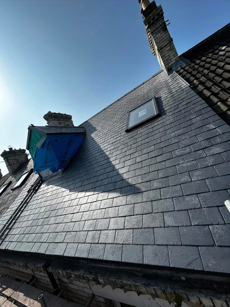 Natural slate roof with a rooflight and dormer